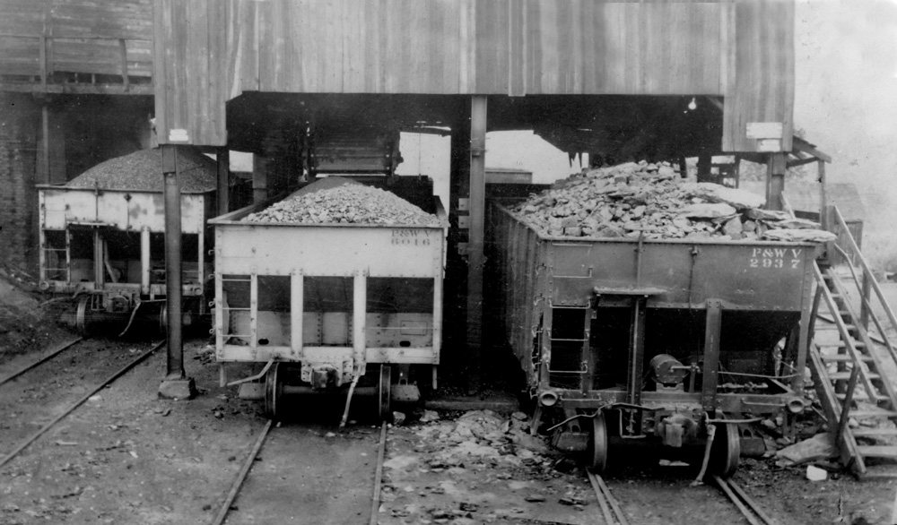 Duquesne Coke and Coal Co. Aurora Mine Tipple at Avella, Pa.  Note the two P&WV battleship grey hoppers on the left.  The reporting marks, stirrups and grab irons were chrome yellow.  Avella Community Center Collection.