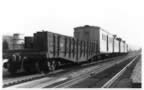 This photo is a rare shot of P&WV bridge and deck M of W rolling stock.  The train consisted of a  composite gondola in oxide red, storeage boxcar (Ex W&LE) which was light grey with black lettering and 3 former New Haven wooden cabs, light grey in color dedicated to M of W.  A twelve man crew worked 8 months of the year painting and cleaning the bridges and decks. (105kb)